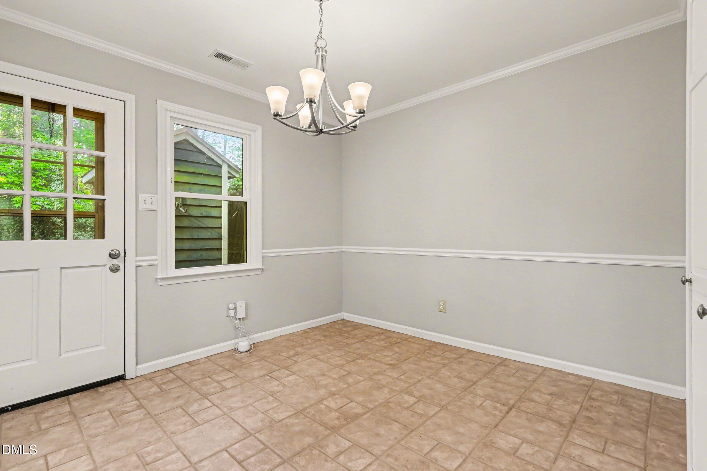 5645 Hamstead Crossing Raleigh, NC 27612 - Photo 14 of 35 a view of empty room with window