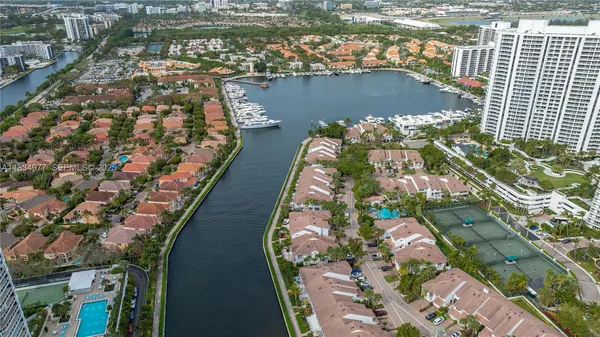 an aerial view of a house with a lake view