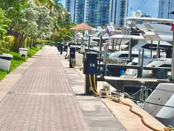 a view of a patio with a table and chairs under an umbrella