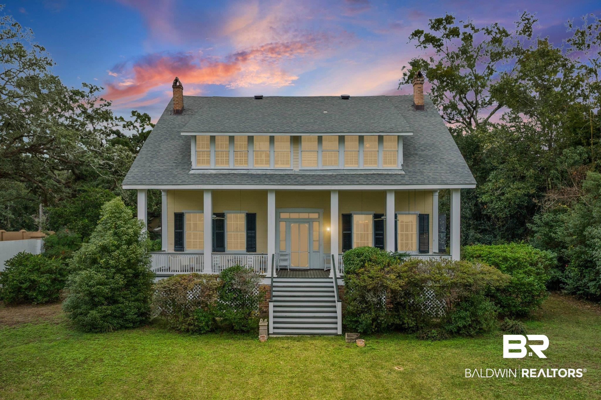 23561 Main Street Fairhope, AL 36532 - Photo 1 of 45 View of front facade with a shingled roof, a chimney, and covered porch
