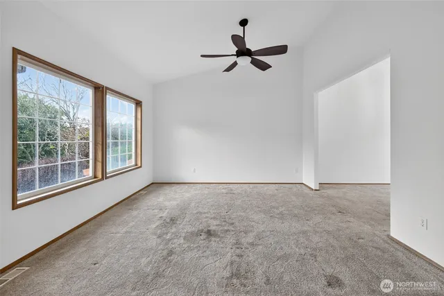 a view of empty room with windows