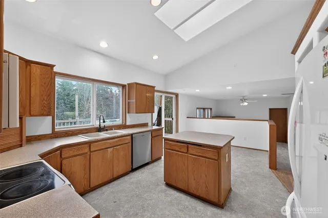 a kitchen with a sink stove and cabinets