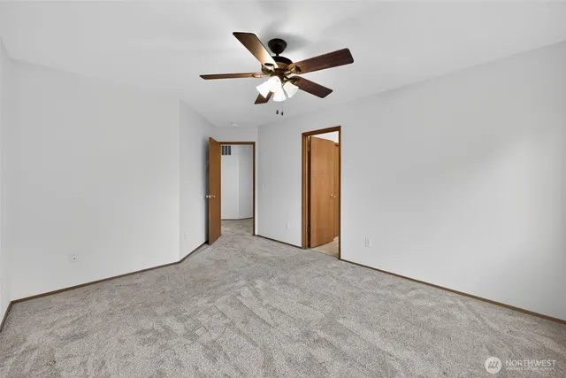 a view of a ceiling fan with a ceiling fan and a window