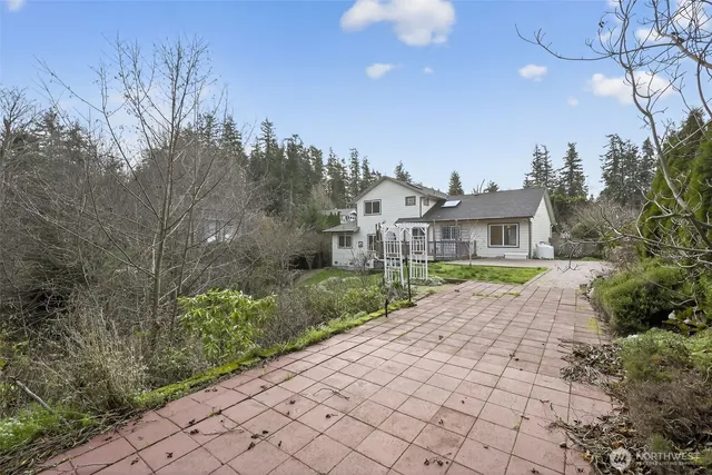 a front view of a house with a yard and pathway