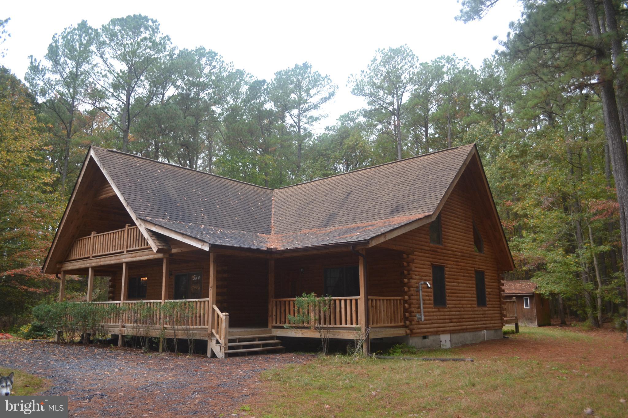 23950 Mt Pleasant Road St. Michaels, MD 21663 - Photo 2 of 38 A true log cabin with spacious covered front porch