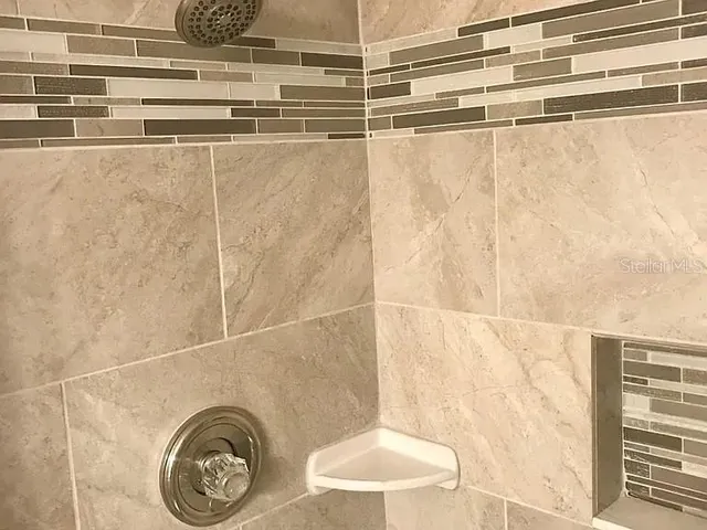 a bathroom with a sink and a shower