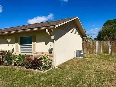 a backyard of a house with lots of green space