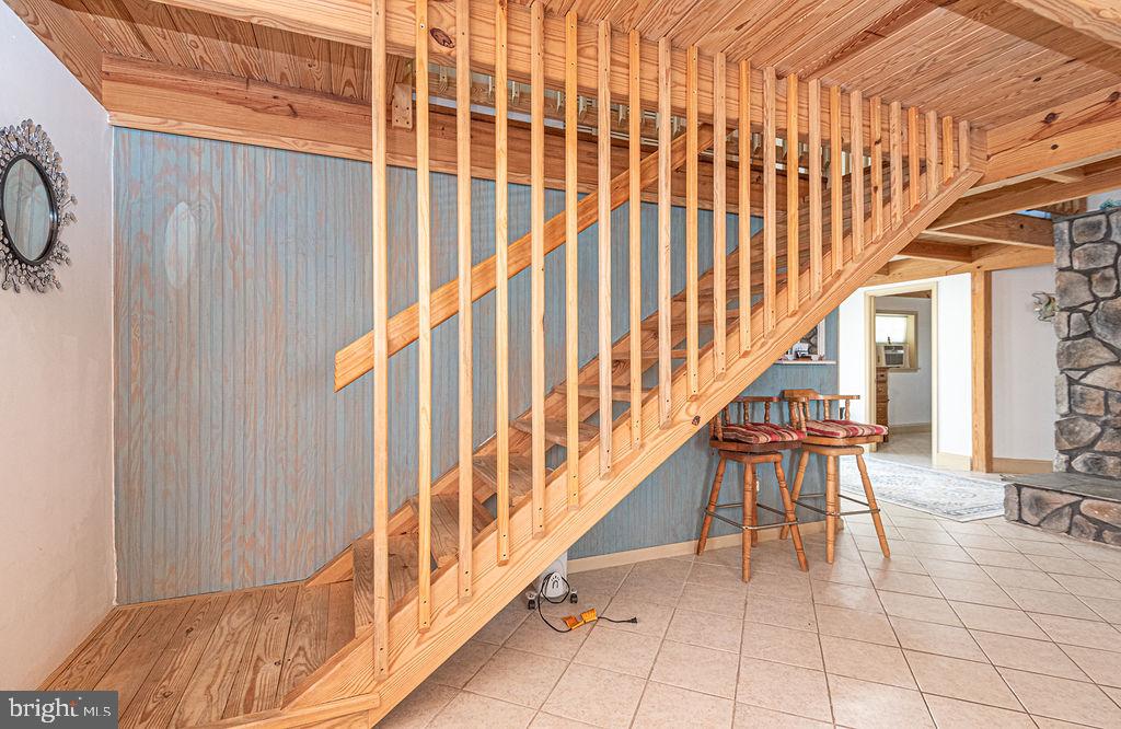 36107 Camp Barnes Road Frankford, DE 19945 - Photo 26 of 83 a view of entryway with wooden floor and stairs