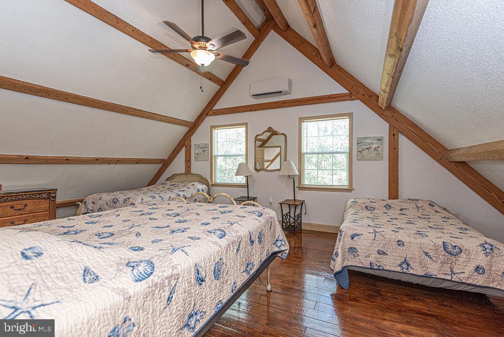 36107 Camp Barnes Road Frankford, DE 19945 - Photo 32 of 83 a bedroom with a large bed and a window