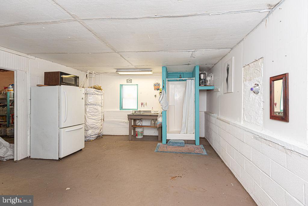 36107 Camp Barnes Road Frankford, DE 19945 - Photo 50 of 83 a view of a storage & utility room with closet dryer