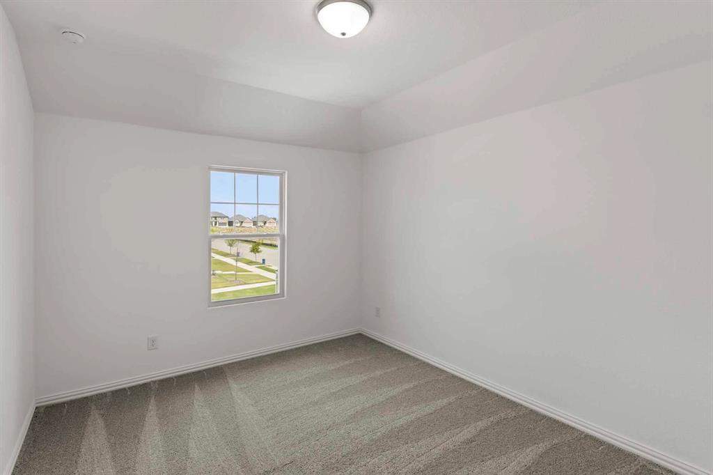 1304 Abbott Crk Road Celina, TX 75009 - Photo 20 of 29 an empty room with windows