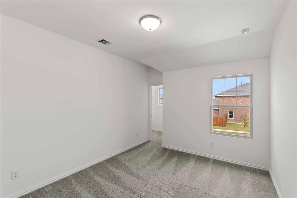 1304 Abbott Crk Road Celina, TX 75009 - Photo 21 of 29 an empty room with windows