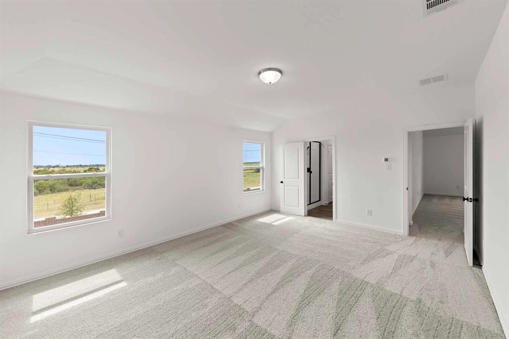 1304 Abbott Crk Road Celina, TX 75009 - Photo 25 of 29 a view of an empty room with window and closet area