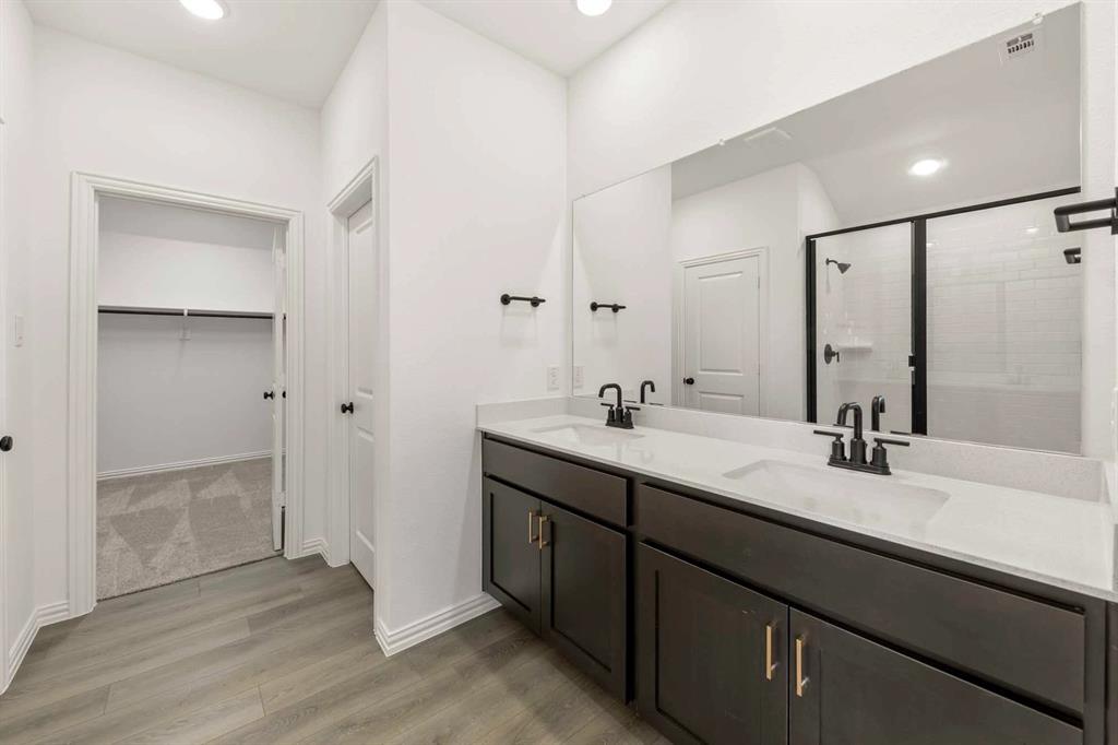 1304 Abbott Crk Road Celina, TX 75009 - Photo 26 of 29 a bathroom with a double vanity sink mirror and double