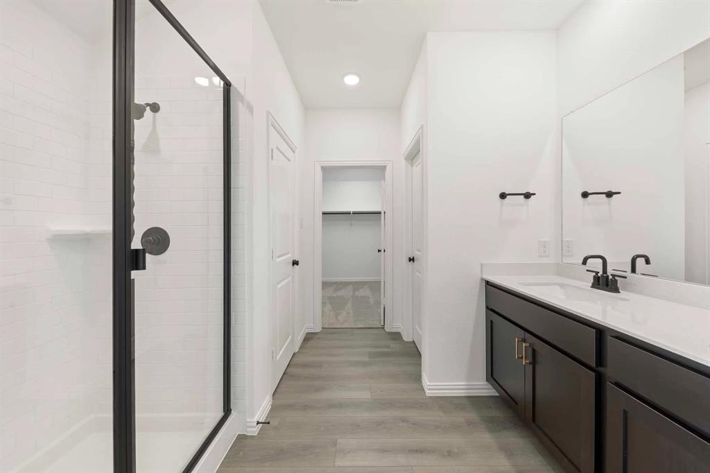 1304 Abbott Crk Road Celina, TX 75009 - Photo 27 of 29 a bathroom with a sink and a mirror