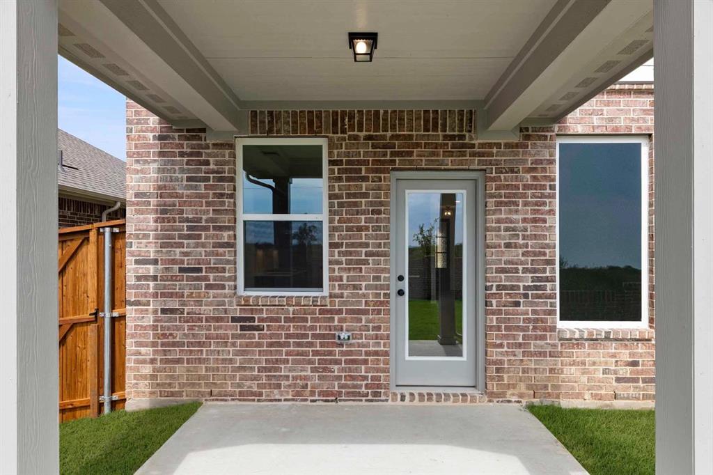 1304 Abbott Crk Road Celina, TX 75009 - Photo 5 of 29 a brick house with front door
