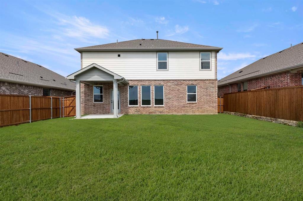 1304 Abbott Crk Road Celina, TX 75009 - Photo 6 of 29 a front view of a house with a garden