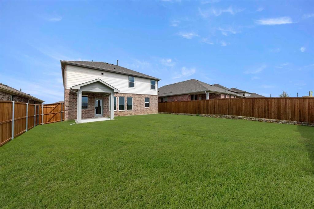 1304 Abbott Crk Road Celina, TX 75009 - Photo 7 of 29 a front view of house with yard and green space