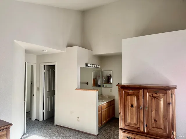 a bedroom with a bed and a walk in closet