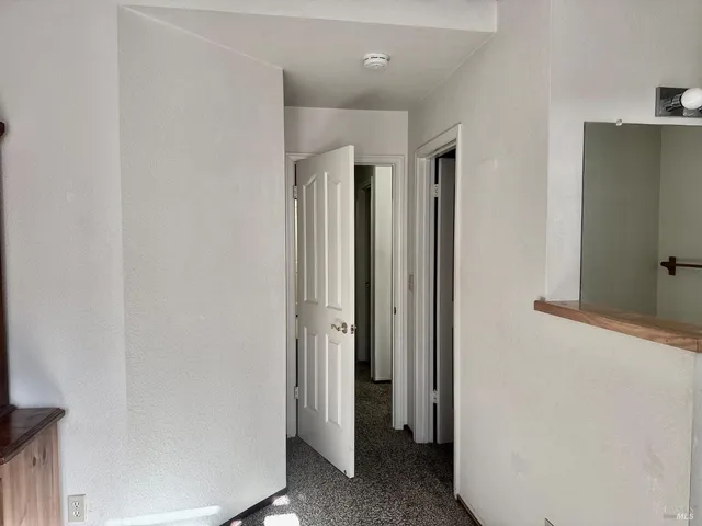 a view of a bathroom with a hallway