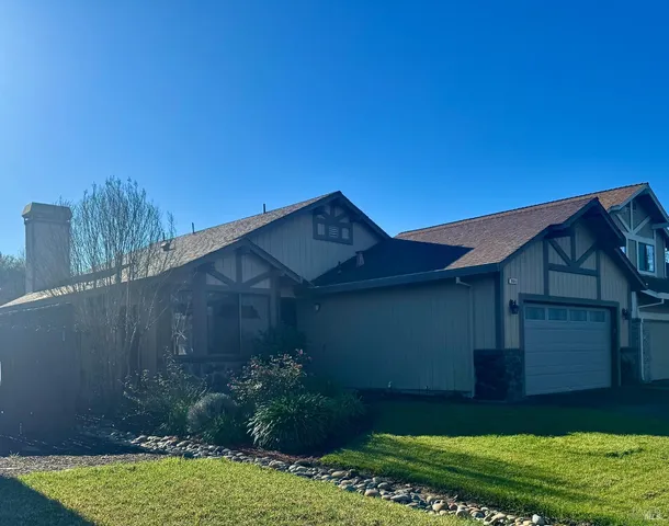 a backyard of a house with lots of green space