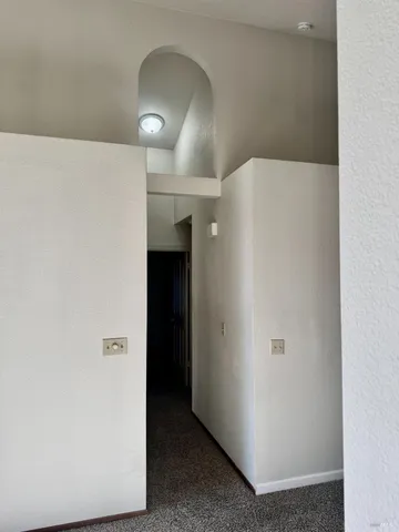 a view of empty room with a fireplace