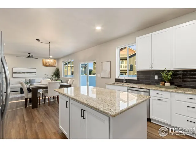 a kitchen with lots of counter top space and dining table