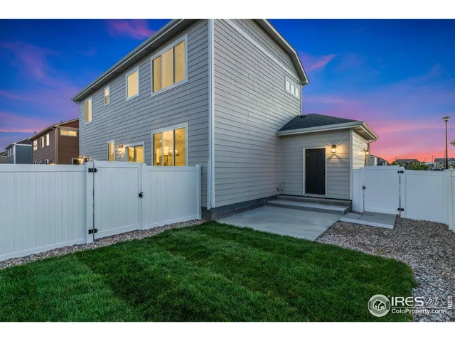 a view of a backyard of the house