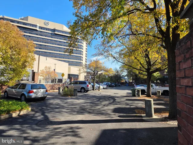a view of street with parked cars
