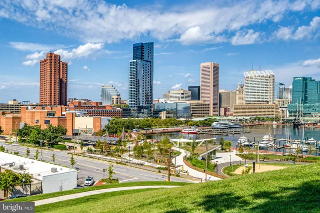 a view of a lake with a table and chairs