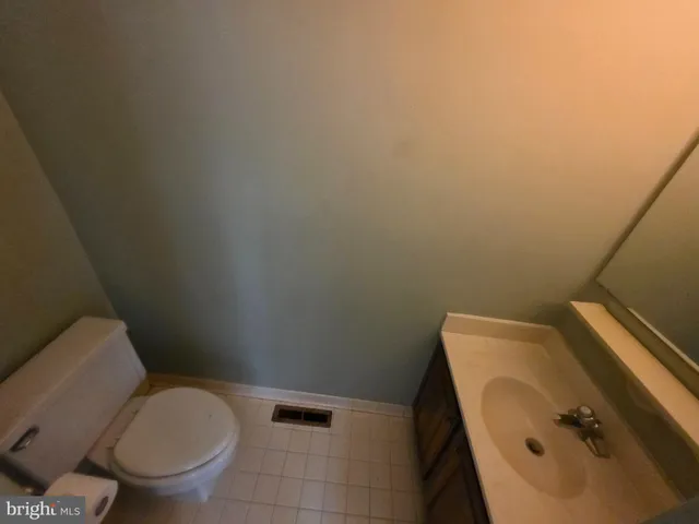 a bathroom with a toilet and a sink