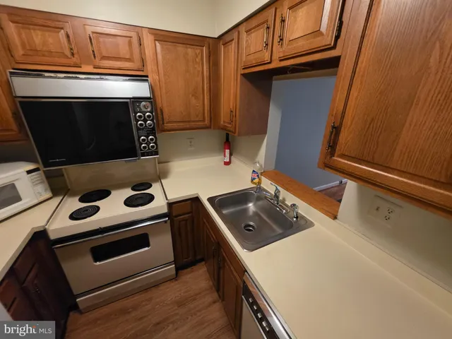 a kitchen with a stove and a microwave