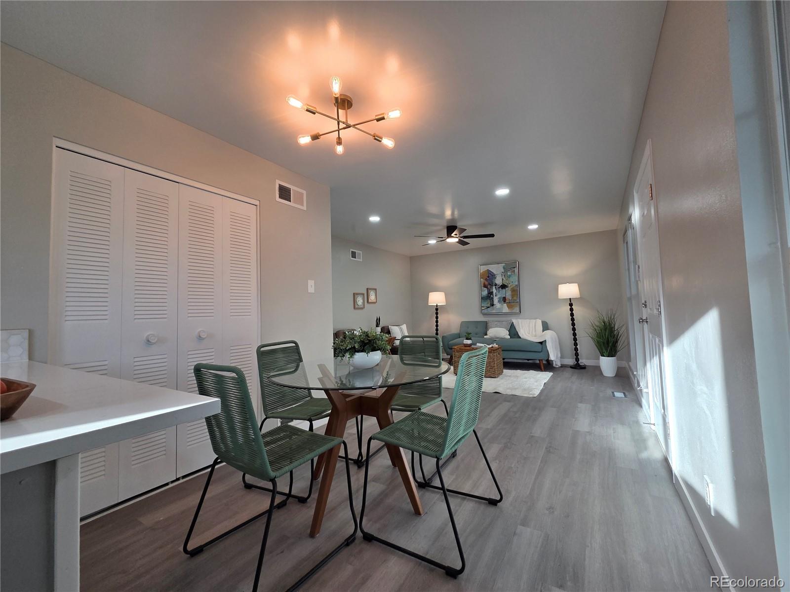 1250 South Monaco Parkway, Unit 17 Denver, CO 80224 - Photo 12 of 29 a view of a dining room with furniture