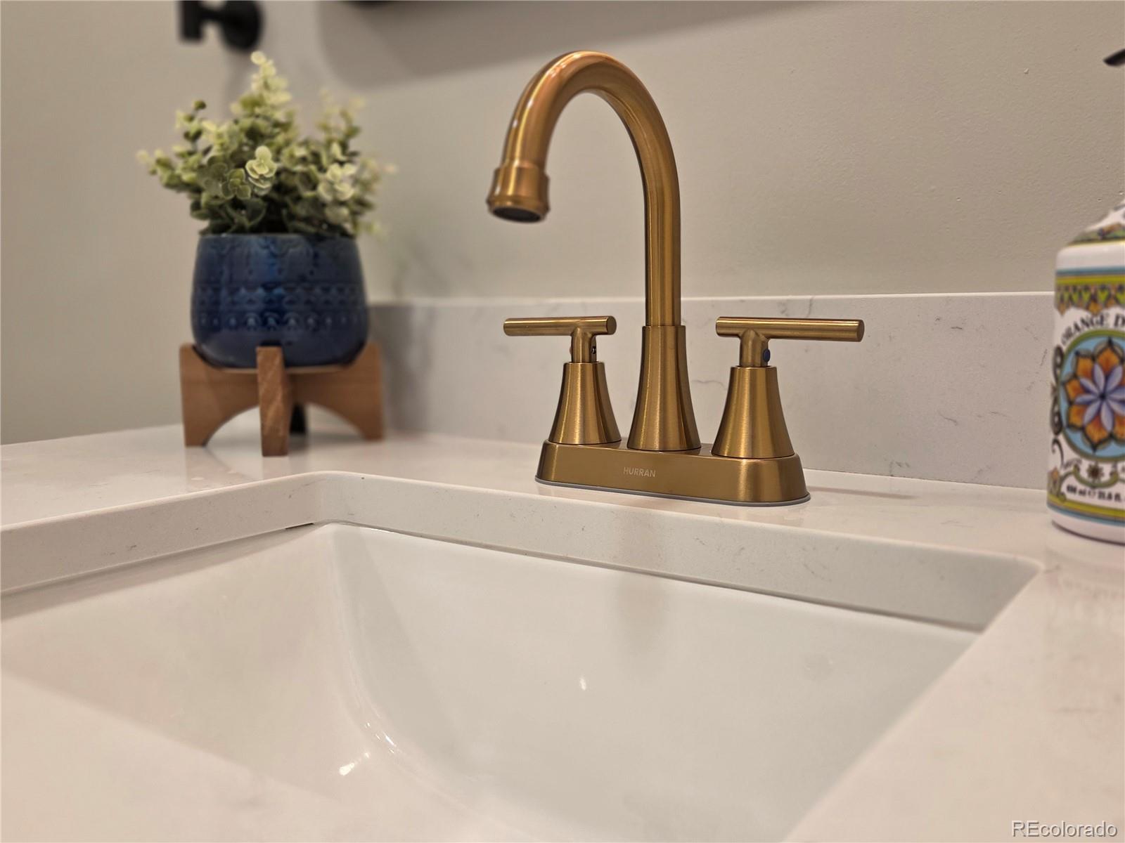 1250 South Monaco Parkway, Unit 17 Denver, CO 80224 - Photo 16 of 29 a bathroom with a sink and a mirror
