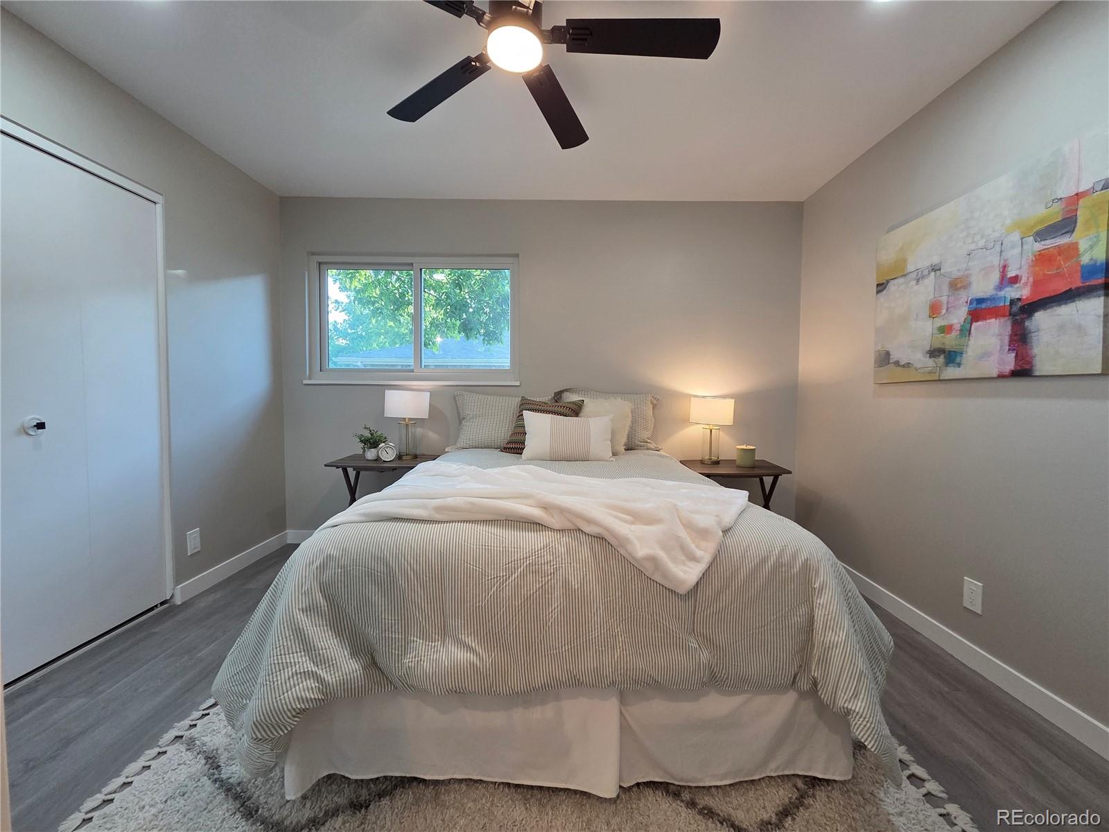 1250 South Monaco Parkway, Unit 17 Denver, CO 80224 - Photo 17 of 29 a bedroom with a bed and window