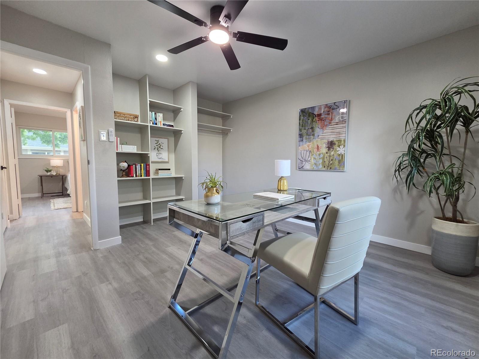 1250 South Monaco Parkway, Unit 17 Denver, CO 80224 - Photo 21 of 29 a workspace with furniture and wooden floor