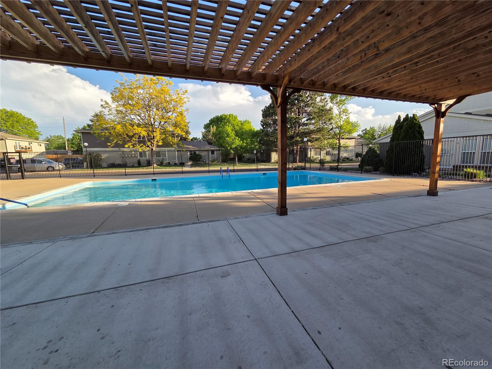 1250 South Monaco Parkway, Unit 17 Denver, CO 80224 - Photo 23 of 29 a view of swimming pool with a patio