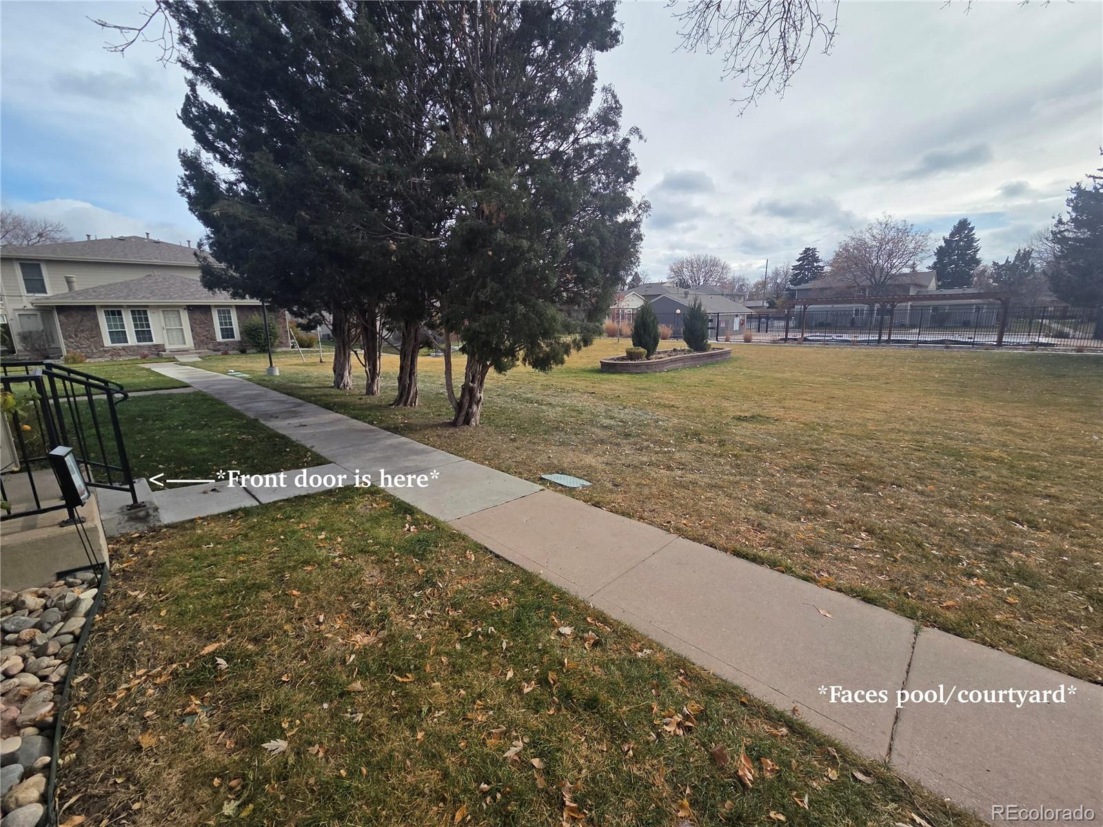 1250 South Monaco Parkway, Unit 17 Denver, CO 80224 - Photo 27 of 29 a view of a house with a yard