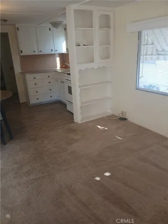a view of an empty room and closet
