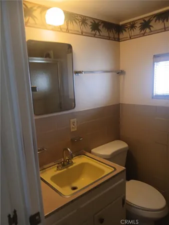 a bathroom with a sink and toilet