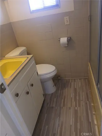 a bathroom with a toilet and a sink