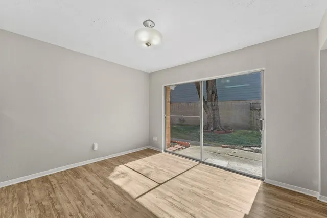 a room that has a bed and a glass door