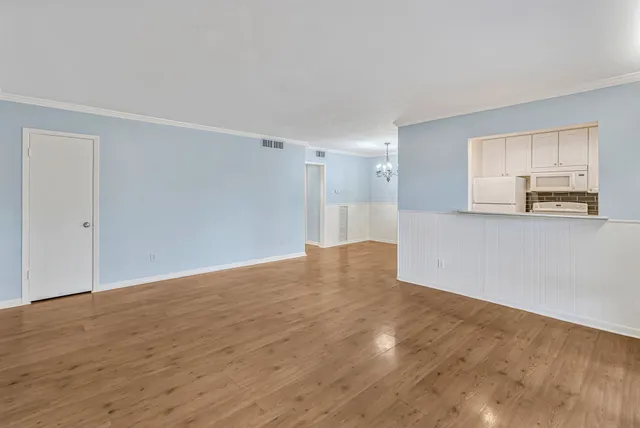 a view of a livingroom with wooden floor