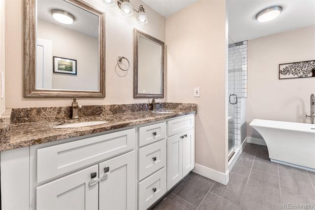 a bathroom with a granite countertop sink mirror and a