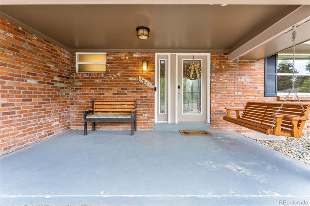 a view of a house with porch and a balcony