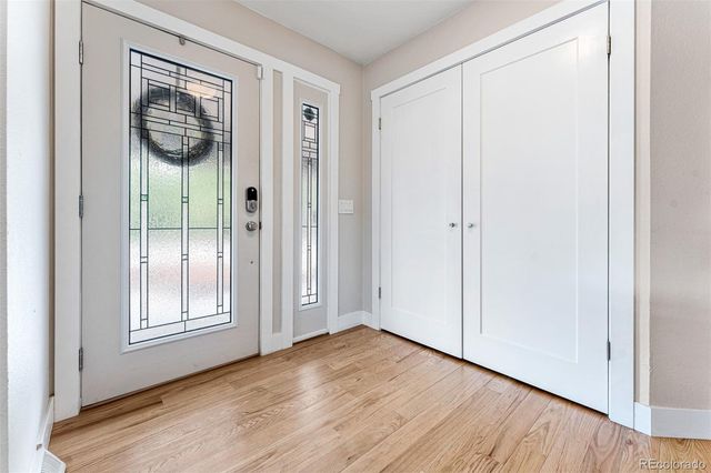 a view of an entryway with wooden floor
