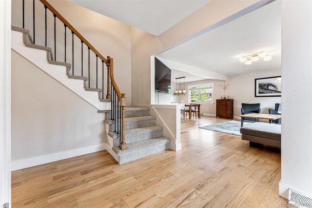 a view of a livingroom with furniture and a flat screen tv