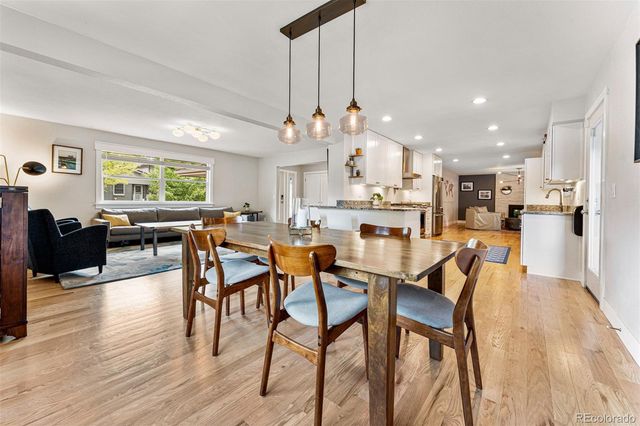 a view of a dining area with furniture window and wooden floor