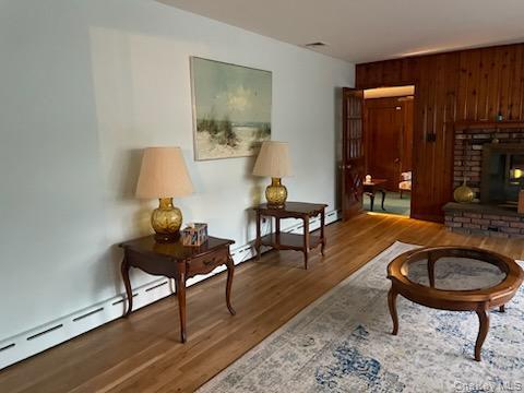 8 Atlantic Avenue Blue Point, NY 11715 - Photo 13 of 24 a living room with furniture and a lamp