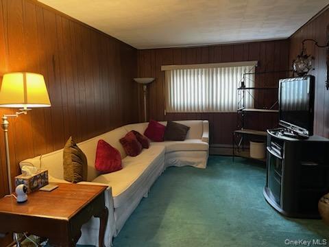 8 Atlantic Avenue Blue Point, NY 11715 - Photo 16 of 24 a living room with furniture and a window